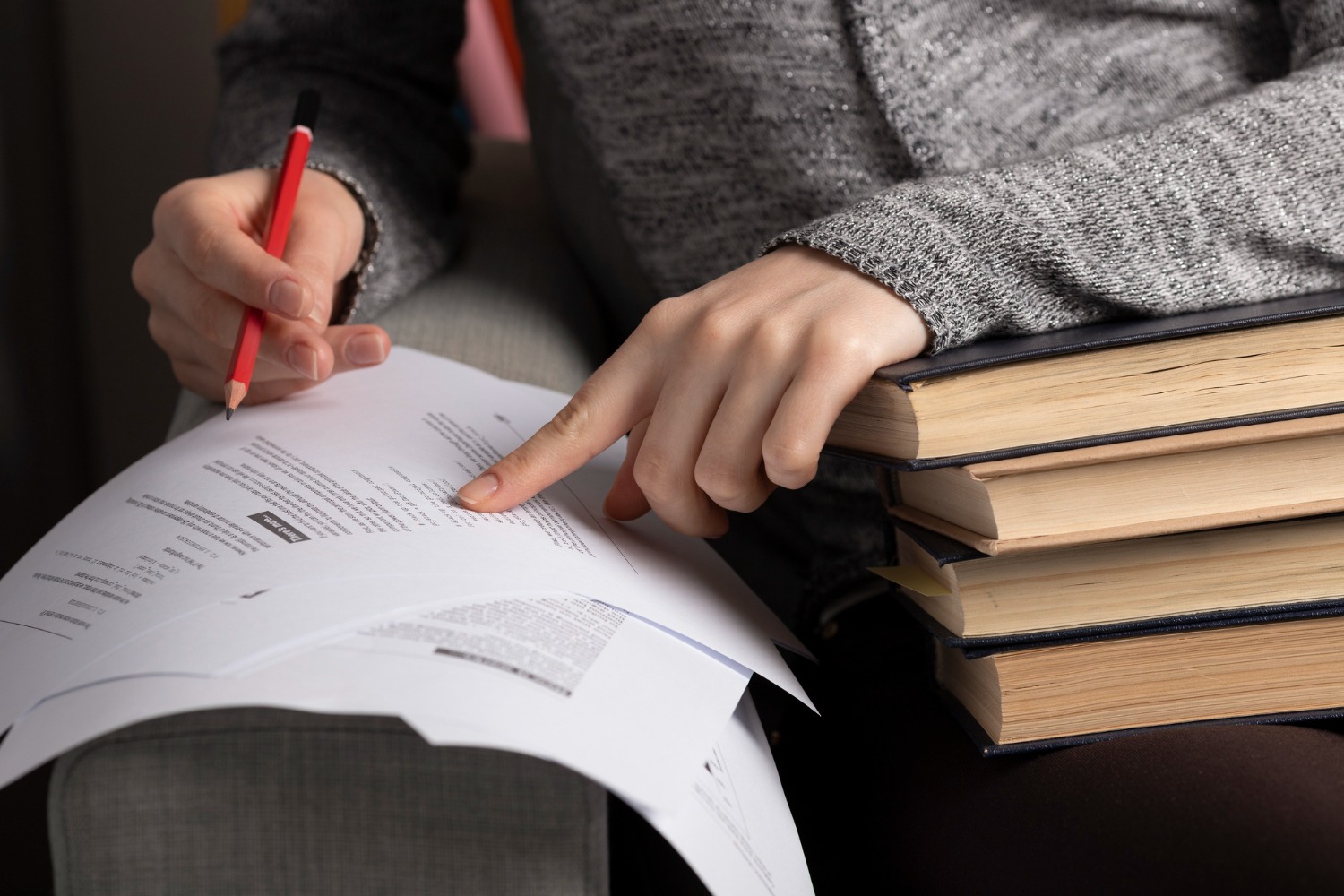 2149314035 front-view-stacked-book-with-glasses-academic-cap